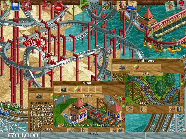 Ảnh chụp màn hình game RollerCoaster Tycoon với công viên giải trí đông đúc khách tham quan và các trò chơi pixel