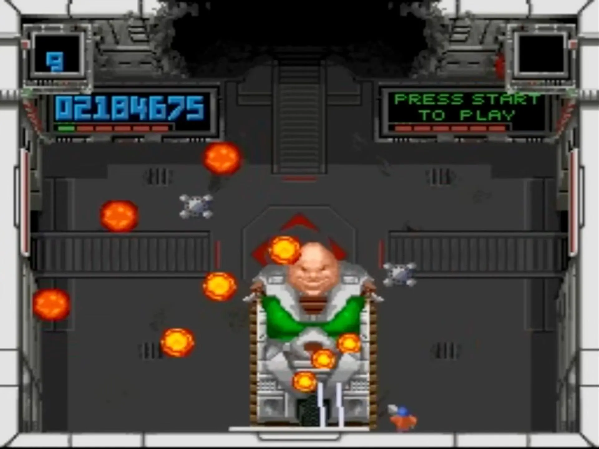 Ảnh chụp màn hình game Super Smash TV trên SNES, hiển thị cảnh hành động hỗn loạn với nhân vật chính bắn hạ nhiều kẻ thù trong một đấu trường.