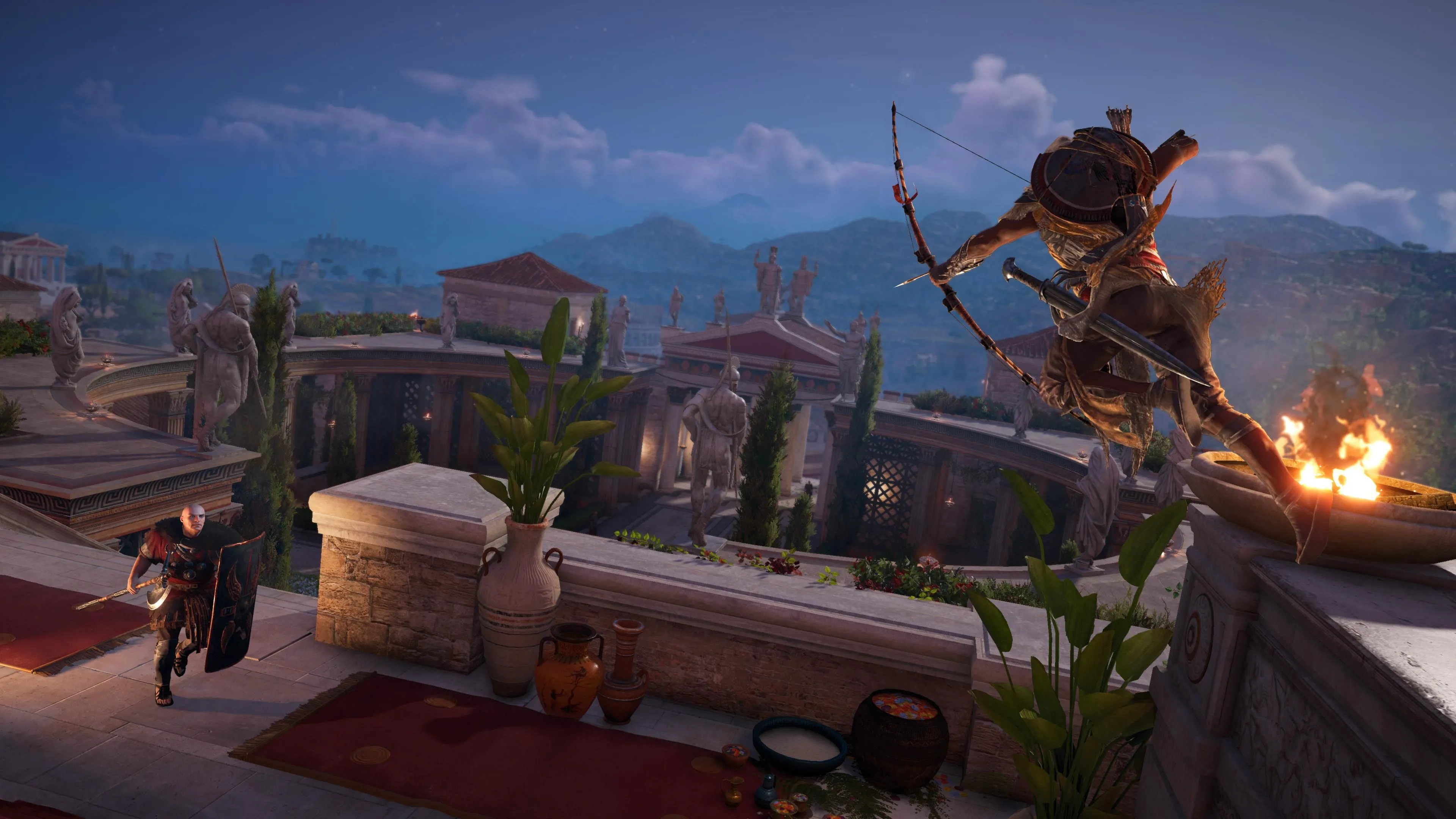 Bayek, nhân vật chính của Assassin's Creed Origins, đang nhảy từ vách đá và nhắm bắn mục tiêu bằng cung tên