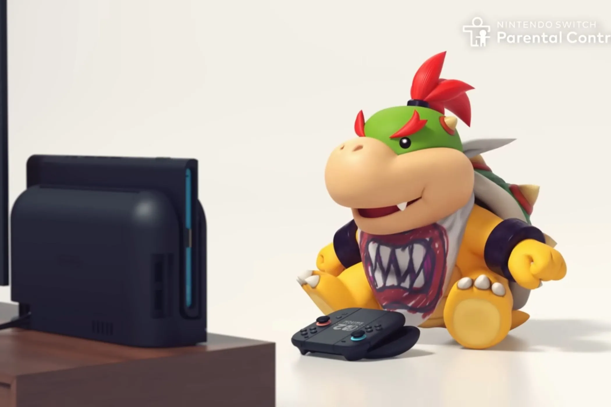 Bé Bowser Jr. ngồi trên ghế sofa chơi Nintendo Switch 2 với camera phụ kiện trên màn hình