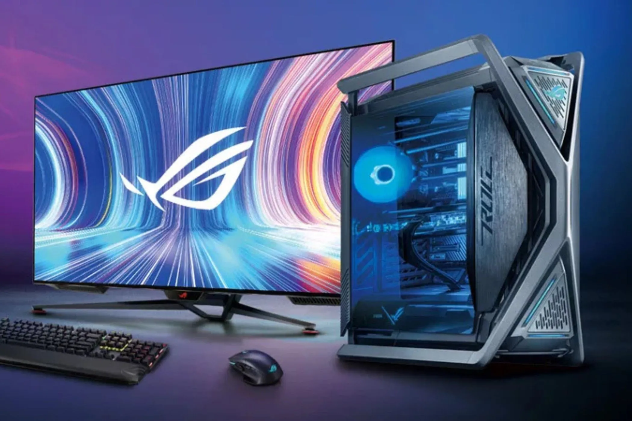 Bộ PC gaming mạnh mẽ với màn hình lớn và bàn phím cơ trên bàn làm việc, minh họa chi phí đầu tư cao cho game thủ PC.