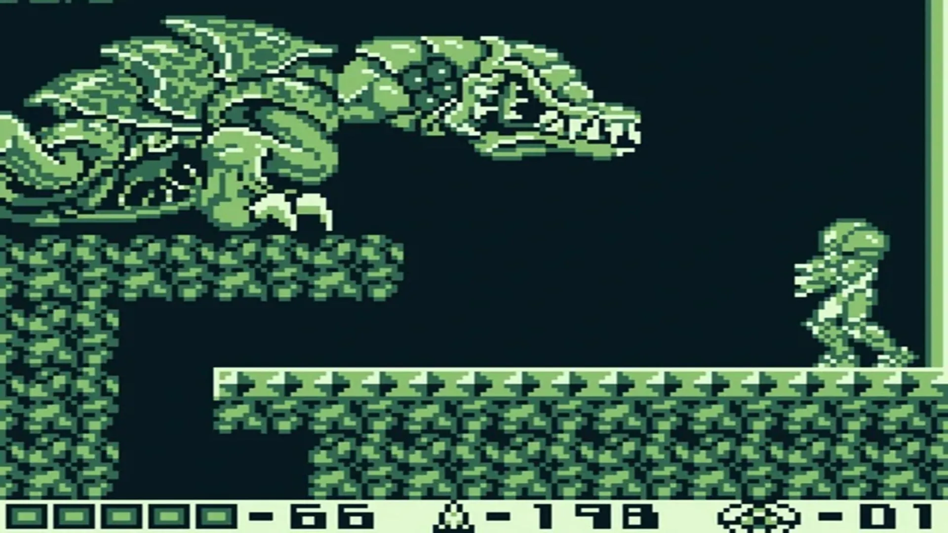 Cảnh chơi game Metroid II: The Return of Samus trên Game Boy, với đồ họa đơn sắc