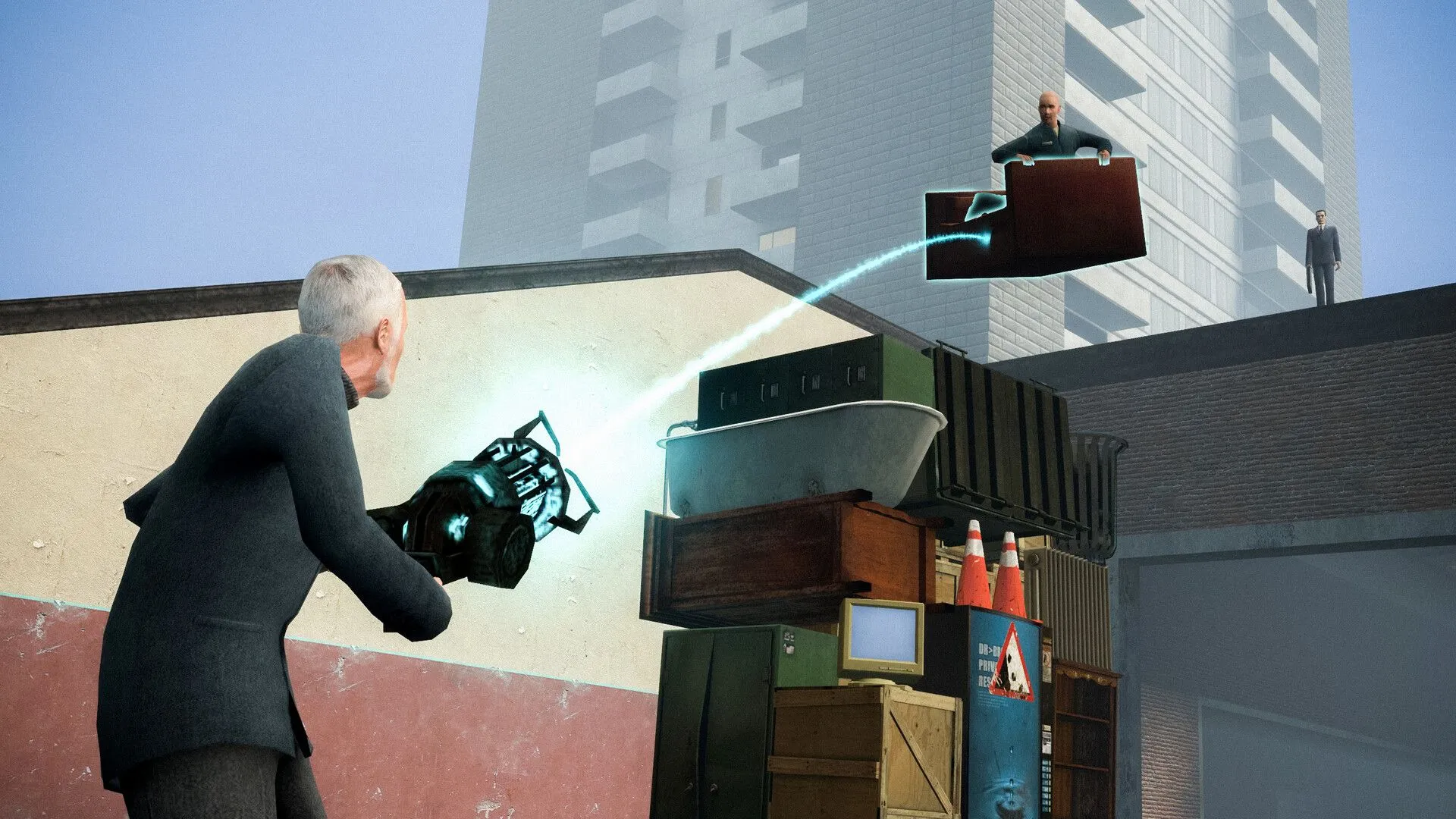 Hai người chơi tương tác với vật thể bằng công cụ vật lý trong Garry's Mod.