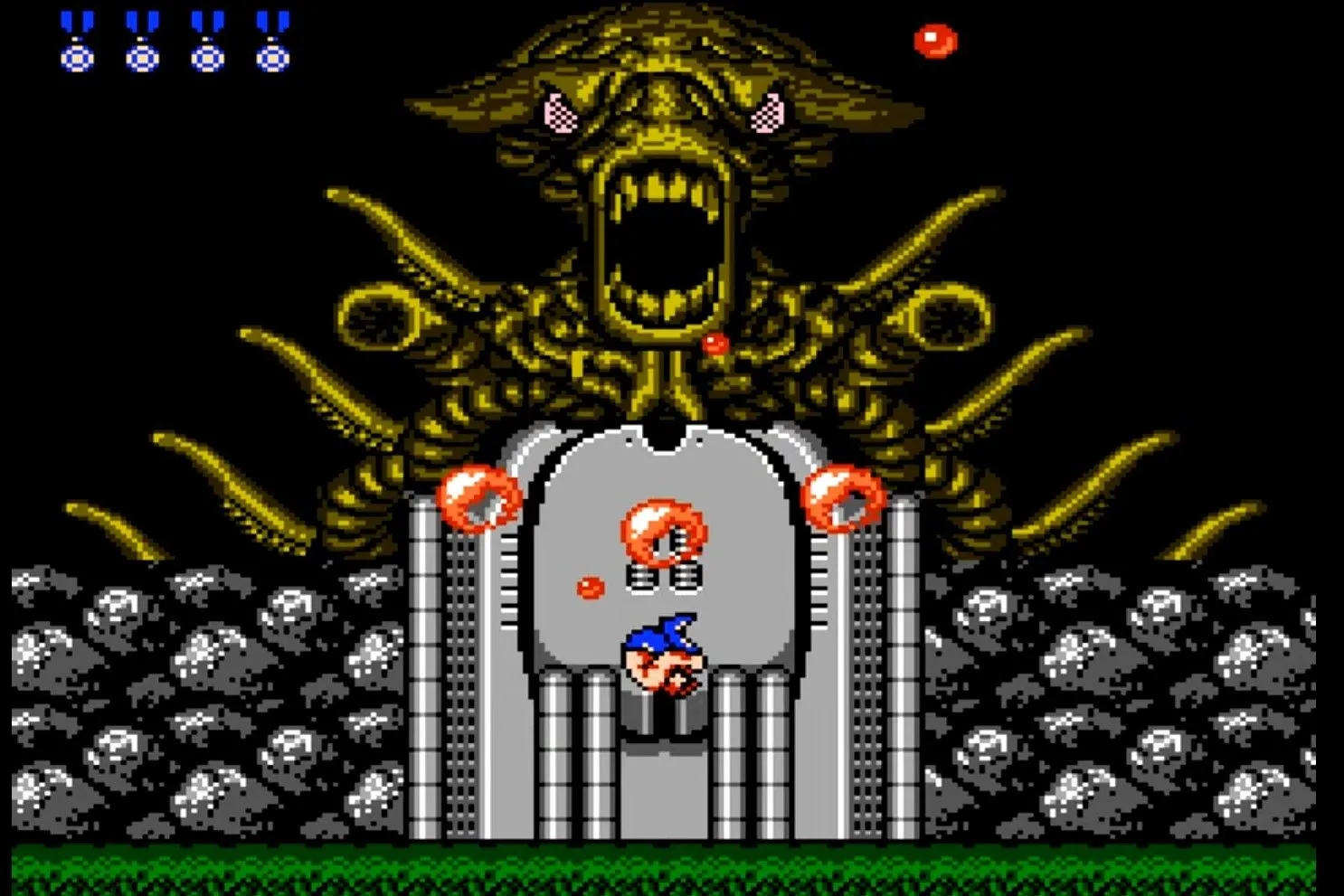Hai nhân vật trong game Contra đang chiến đấu với trùm cuối người ngoài hành tinh trên NES