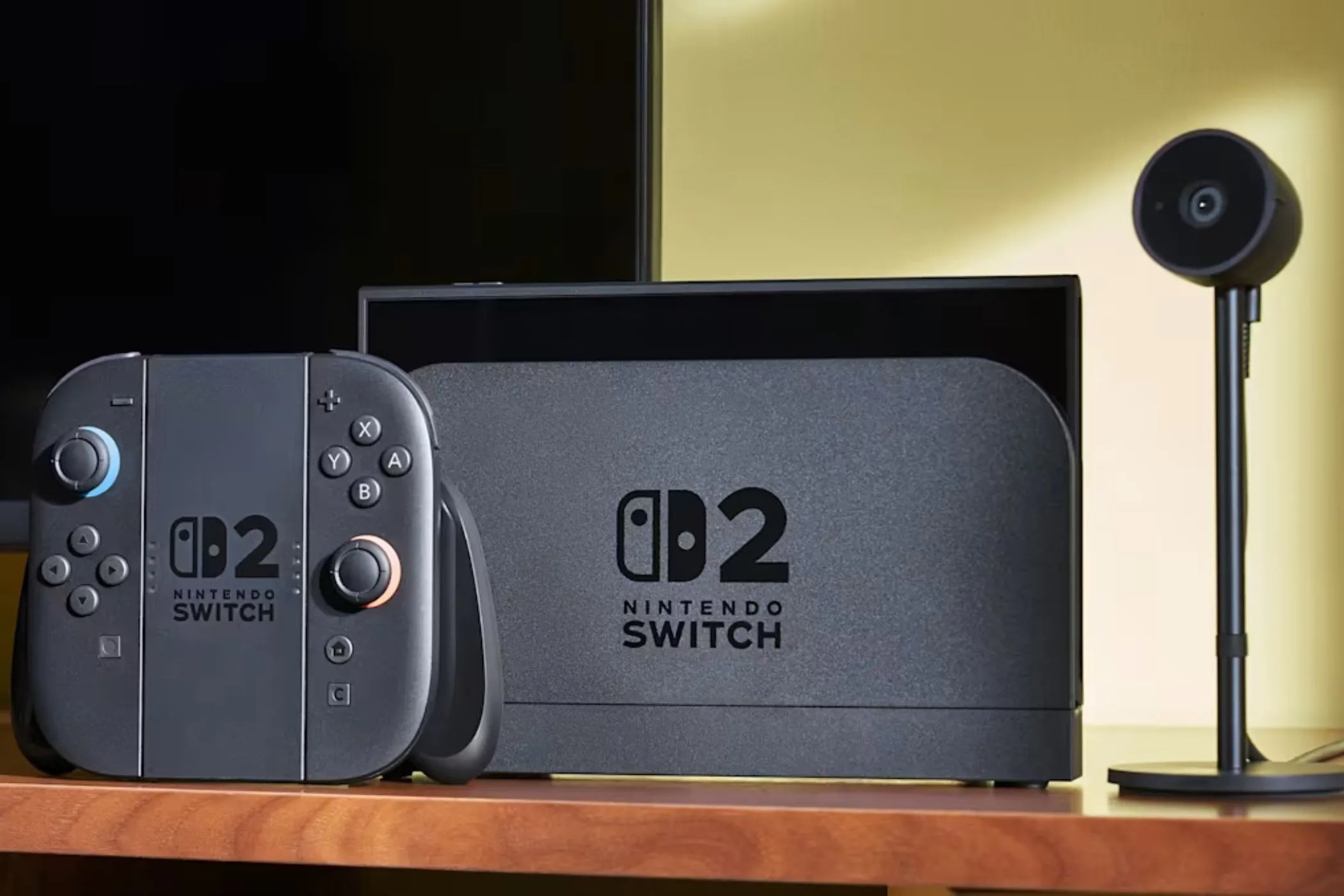Hệ máy Nintendo Switch 2 và camera đặt trên bàn, tượng trưng cho khả năng chơi game đa dạng