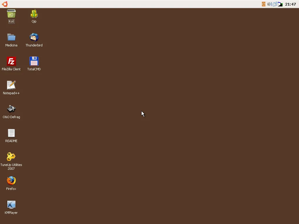 Màn hình desktop của Windows XP Ubuntu với theme Human, biểu tượng tùy chỉnh và các ứng dụng đã cài đặt