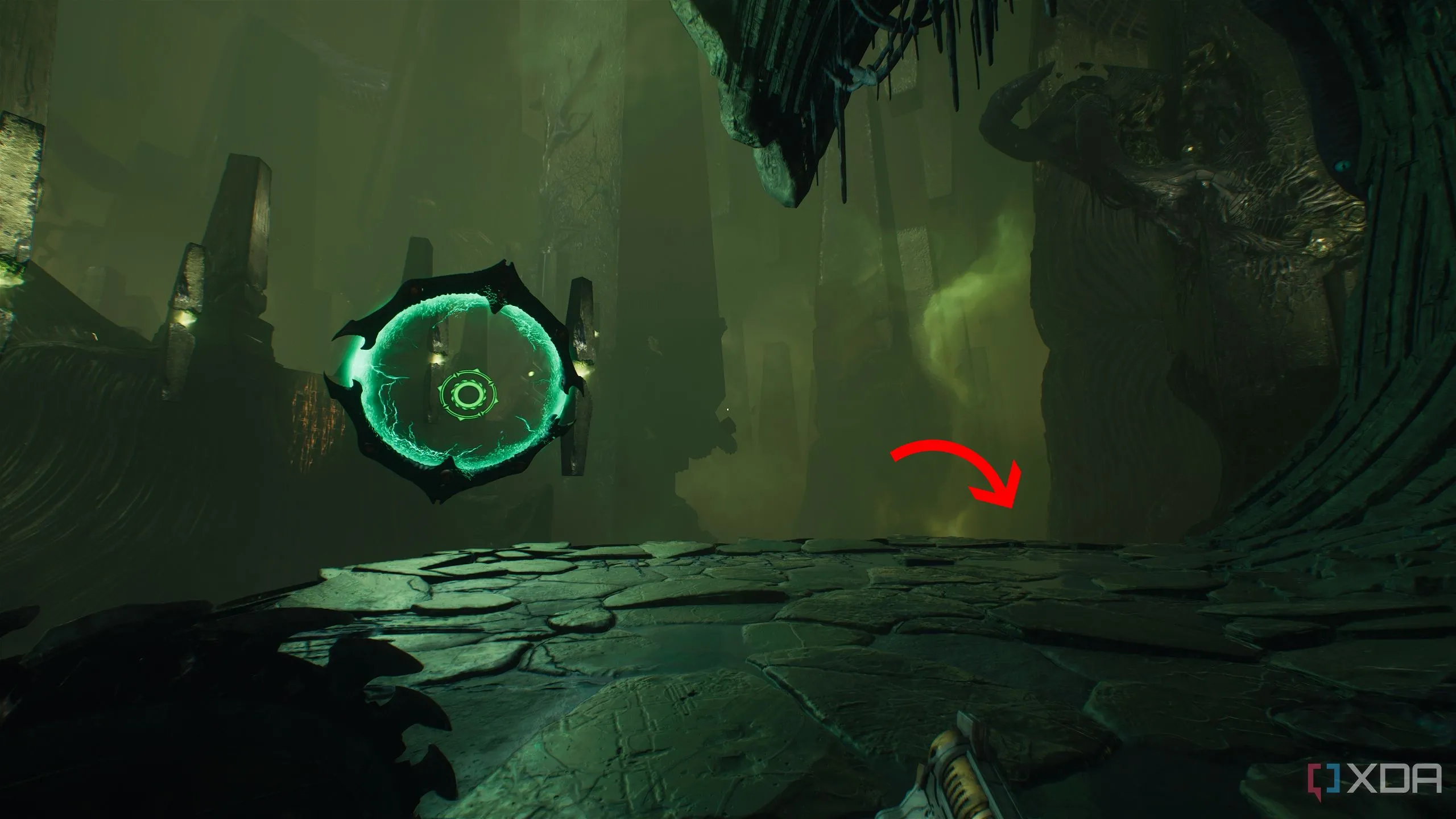 Mũi tên chỉ dẫn hướng xuống bên phải gần cổng Shield Portal trong Doom The Dark Ages Chapter 15
