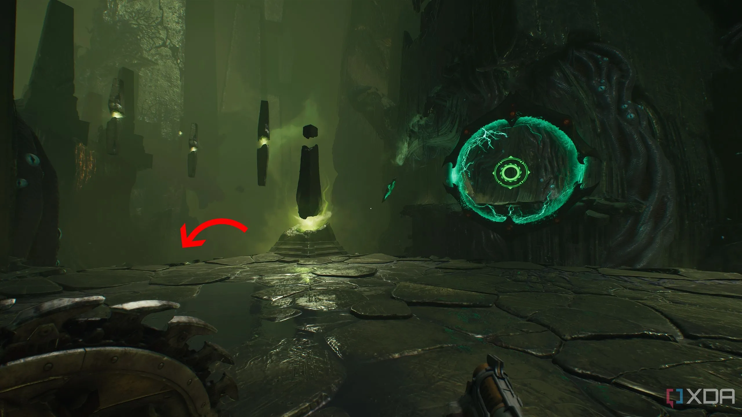 Mũi tên chỉ dẫn hướng xuống bên trái cổng Shield Portal, dẫn đến khu vực bí mật 3 trong Doom The Dark Ages Chapter 15