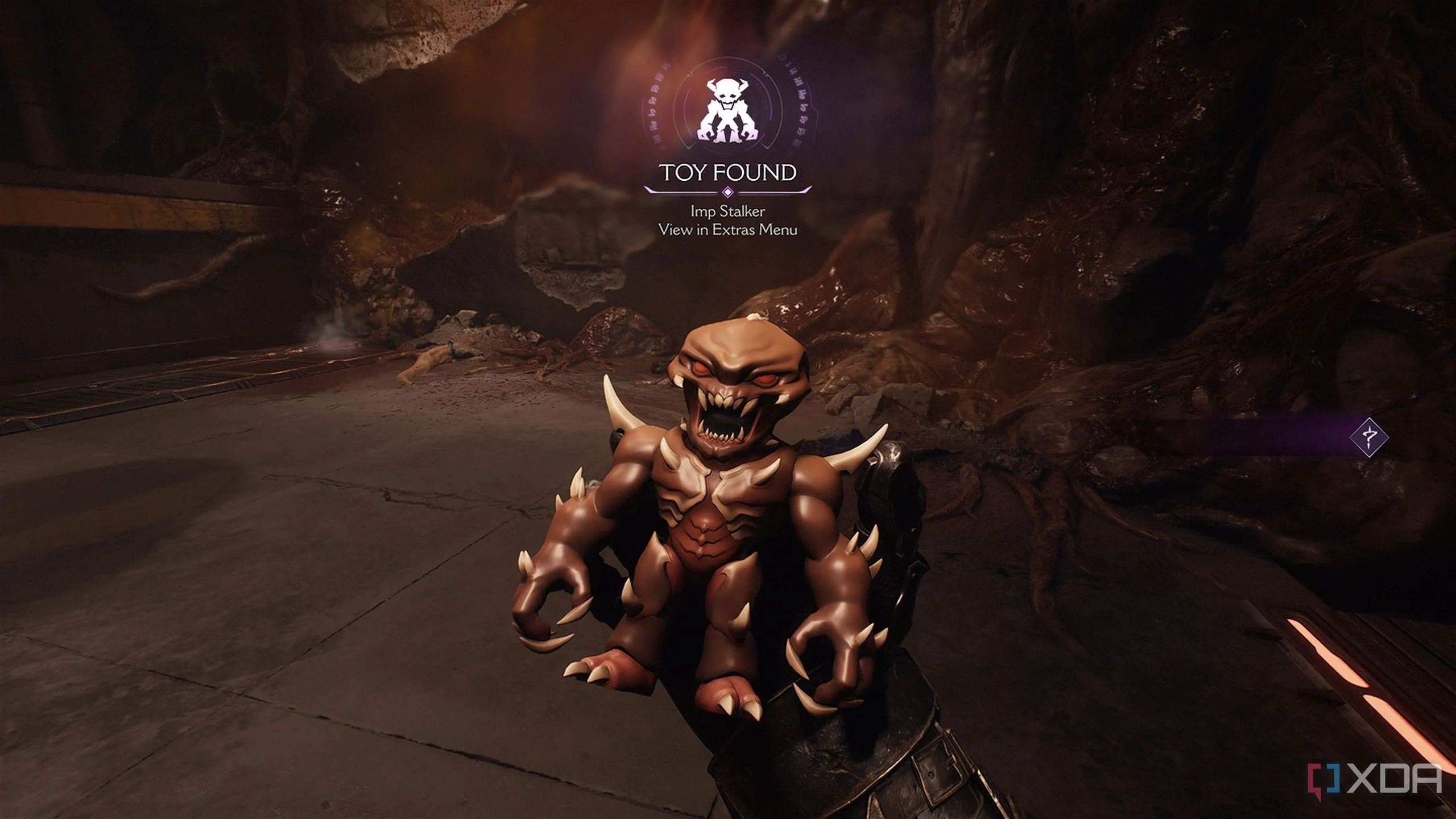 Vật phẩm sưu tầm Imp Stalker Toy hình một con quỷ nhỏ đứng trên bệ đá trong Doom The Dark Ages.